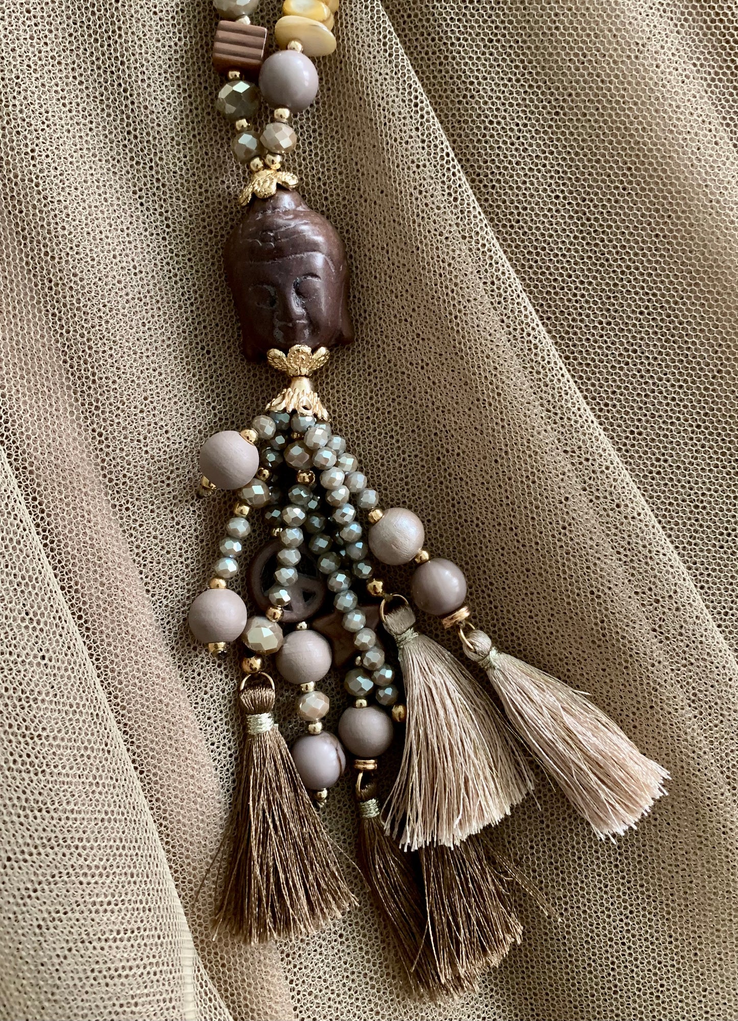 Kette Buddha braun; €29,90 statt €49,90; „ Im Black-Friday-Outlet“ ein super extravagantes Accessoire